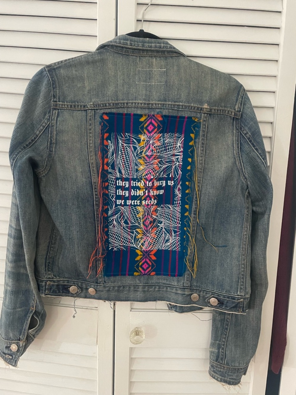 Embroidered Up-cycled Patch Distressed Denim Jacket: “They Tried To Bury Us…”